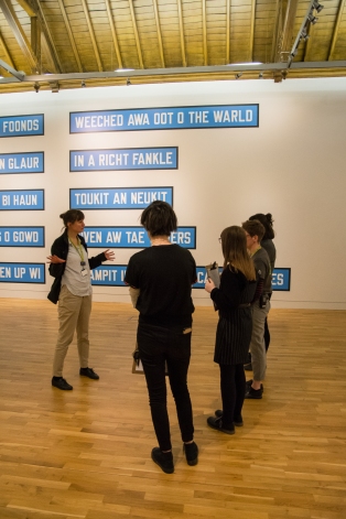 Lili Bartholomew intorducing our Youth Action Group to the ARTIST ROOMS: Lawrence Weiner.